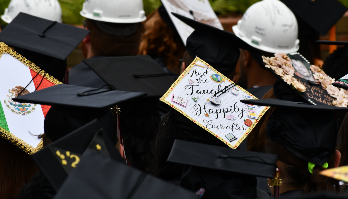 Pictured is a graduation hat that says, 