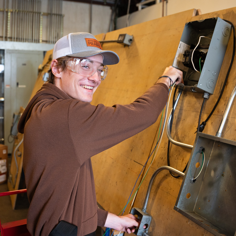 Student works on electrical panel at SCC Manufacturing Week on the Pinehurst campus.