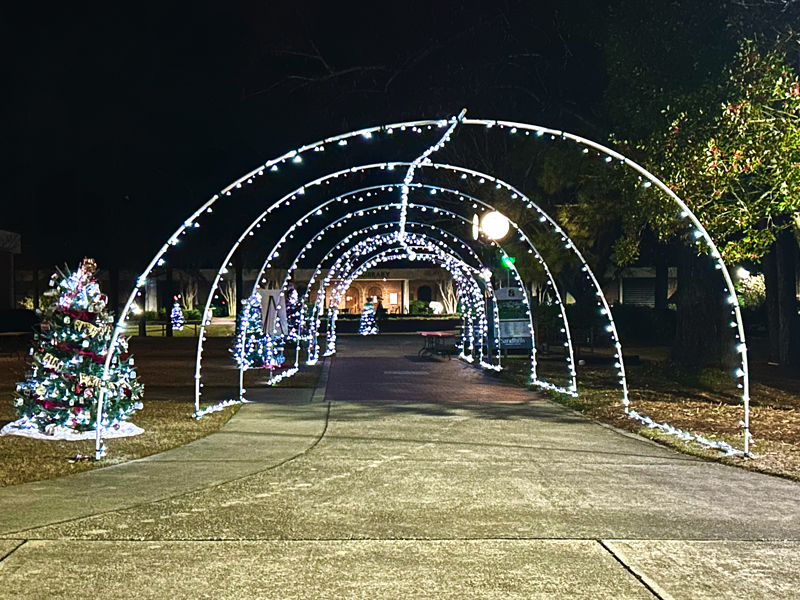 Lighted tunnel frames a walkway on the Sandhills Community College campus as part of the new holiday display.