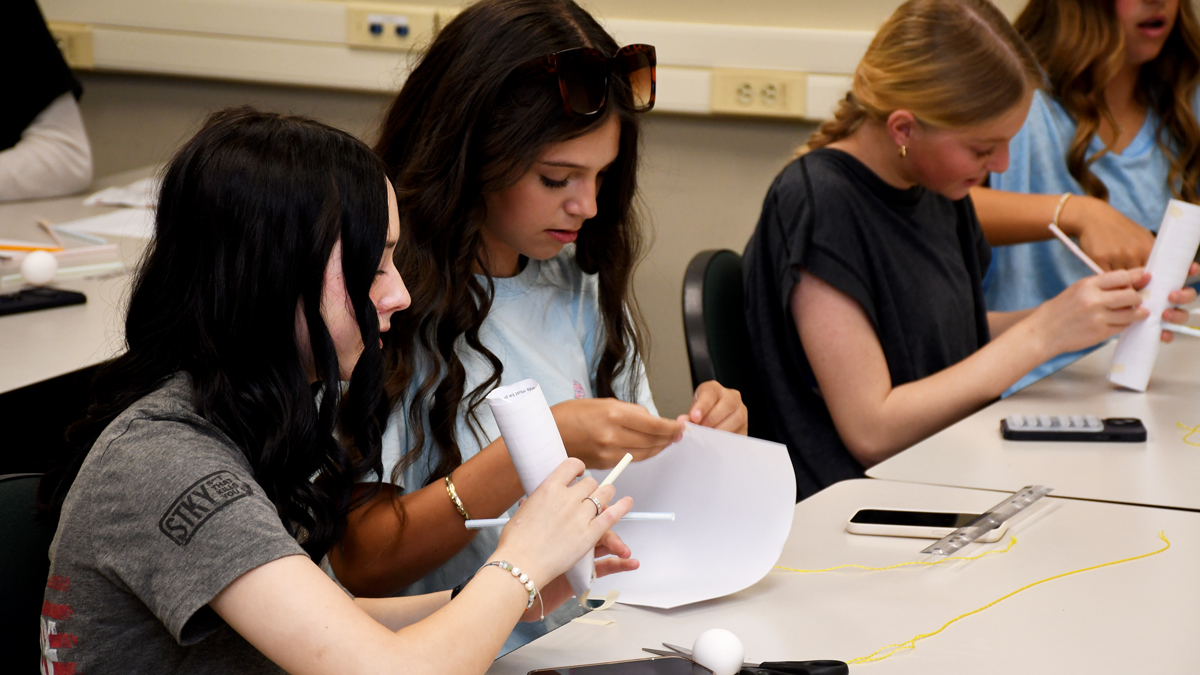 Students build protective containers for eggs in preparation for the FunFest egg drop competition at Sandhills Community College.