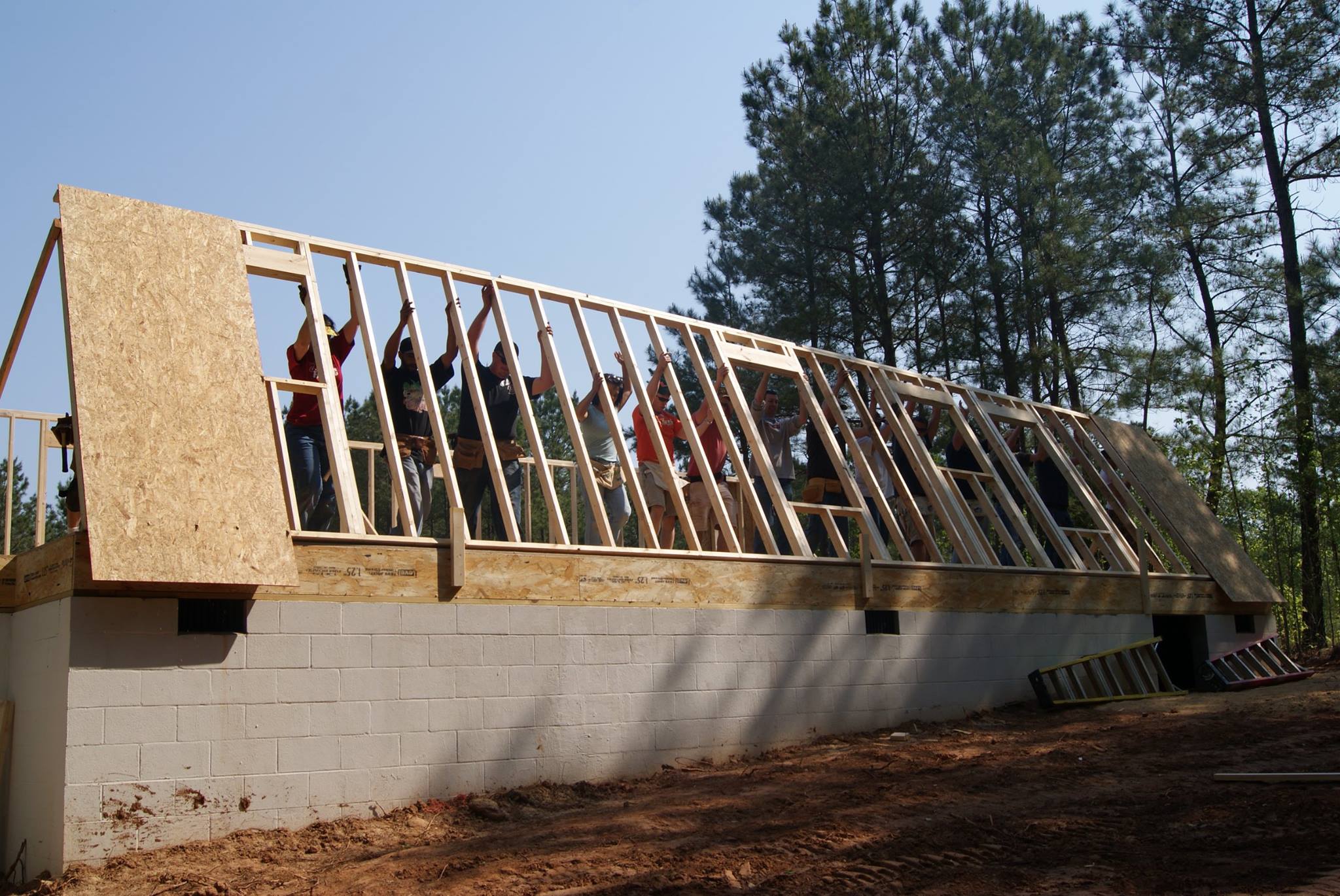 Architectural Students Raising a Building Frame