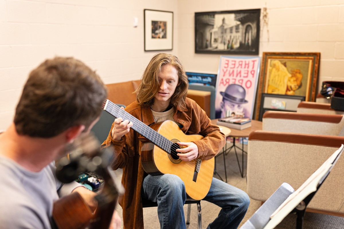 Student Playing Guitar