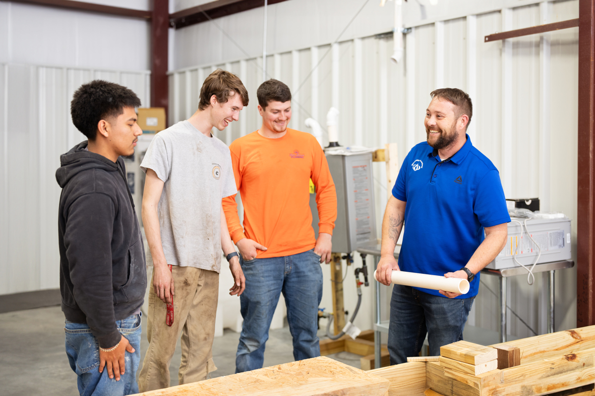 three plumbing students