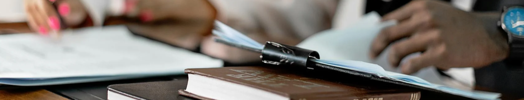 Two people taking notes