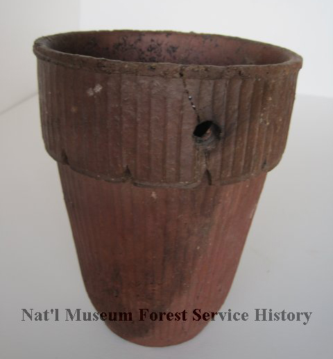 Historic turpentine collection cup used to gather pine resin from longleaf pine trees.