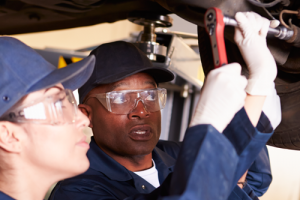 Two Automotive Students working on car