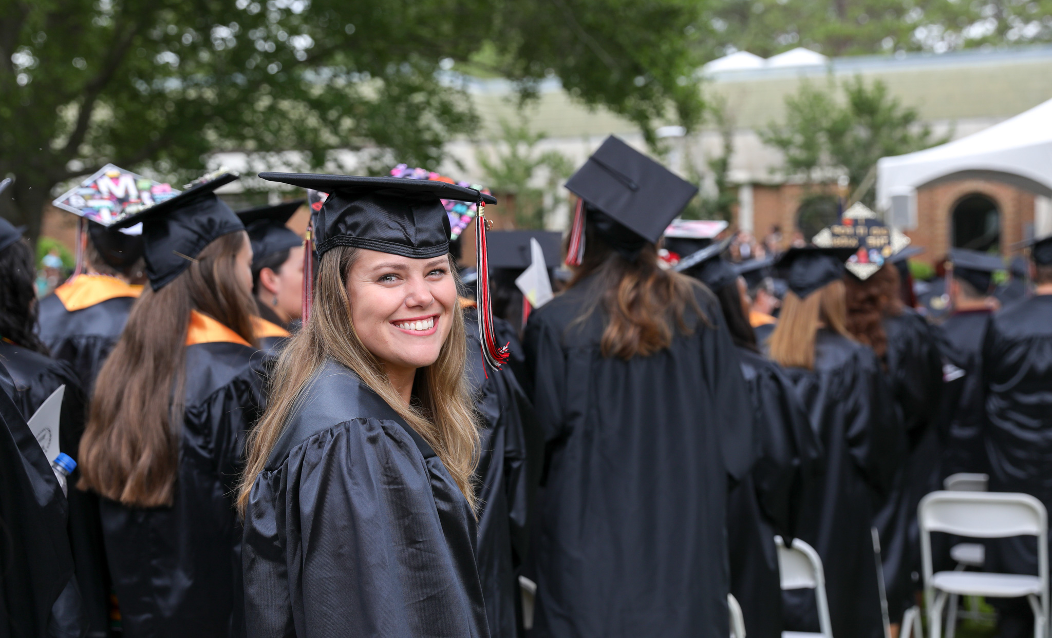  Graduate at ceremony 