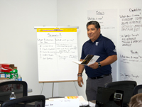 Training session recently held at PTT in Raeford, North Carolina, with facilitator and staff members.