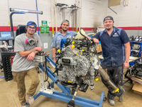 Collision Repair Students Prepare Rehabilitation Vehicle Sandhills Community College Collision Repair students stand beside the engine assembly of a donated Ford Escape while preparing it for conversion into a rehabilitation training vehicle.