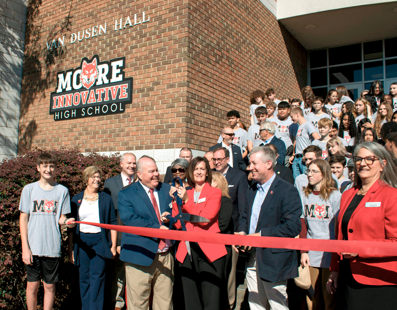 Community leaders and students gather for the Moore Innovative High School ribbon cutting at Sandhills Community College.