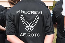 Back of a cadet’s shirt displaying the Pinecrest High School Air Force JROTC logo during the Viking Drill Meet at Sandhills Community College.