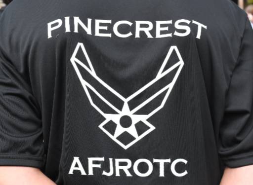 Back of a cadet’s shirt displaying the Pinecrest High School Air Force JROTC logo during the Viking Drill Meet at Sandhills Community College.