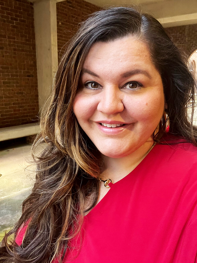 Emily Waldrop, Director of Access to Achievement at Sandhills Community College, smiling in an indoor setting.