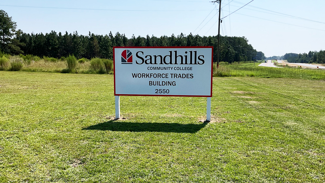 Sandhills Community College Workforce Trades Building sign along the roadside at the Hoke Center.