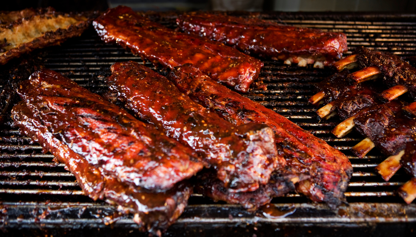 Pictured is BBQ being smoked on a grill