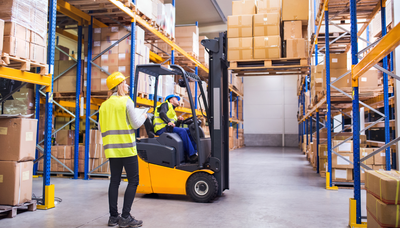 Forklift operator in a warehouse