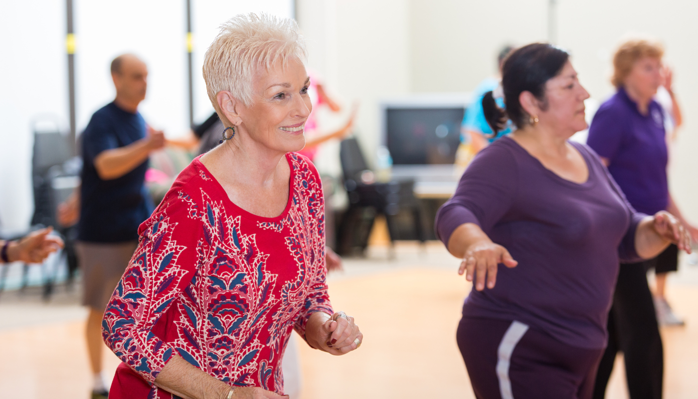 A woman dancing in a line dancing class. 