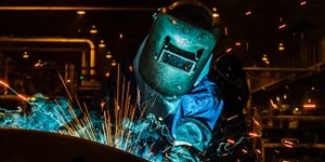 Welder, welding in a car factory