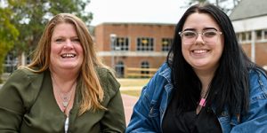 Maggie Duskin, left, and her daughter Lexie, right, pose for a photo outside on the SCC campus.