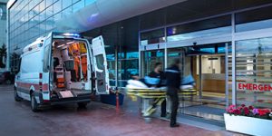 Paramedics taking a patient into the emergency room of a hospital.