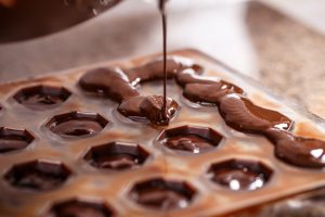 Chocolate being poured into a mold.