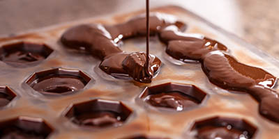 Chocolate being poured into a mold.